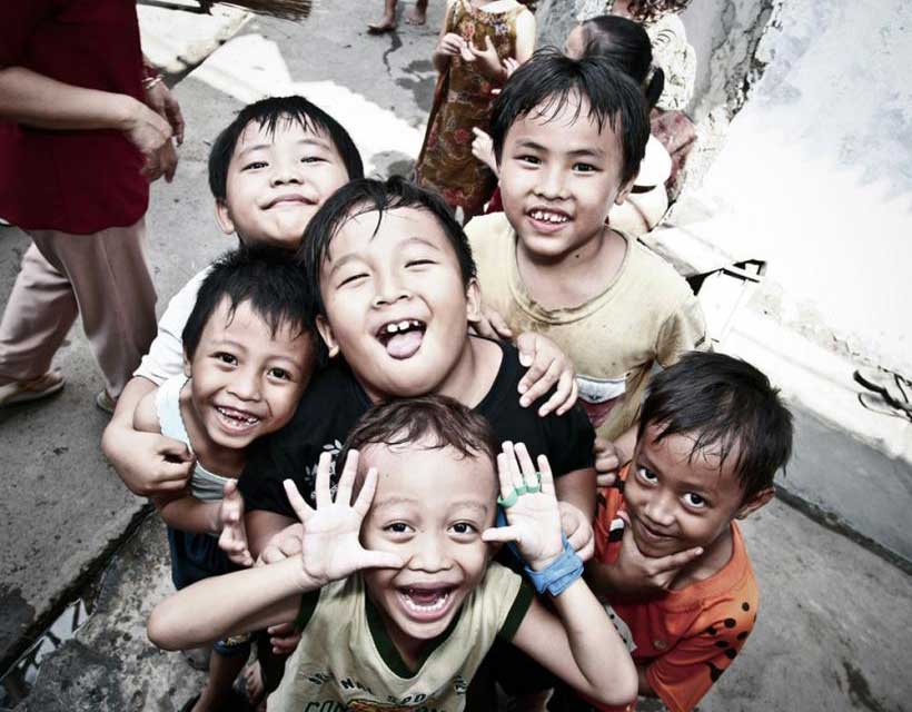 Energetic children of surrounding communities within Jakarta welcome the Global Peace Volunteers.