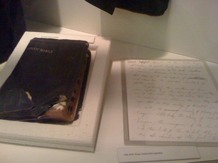 John F. Kennedy's diary, featuring significant entries related to the King Center and a symbolically powerful torch.