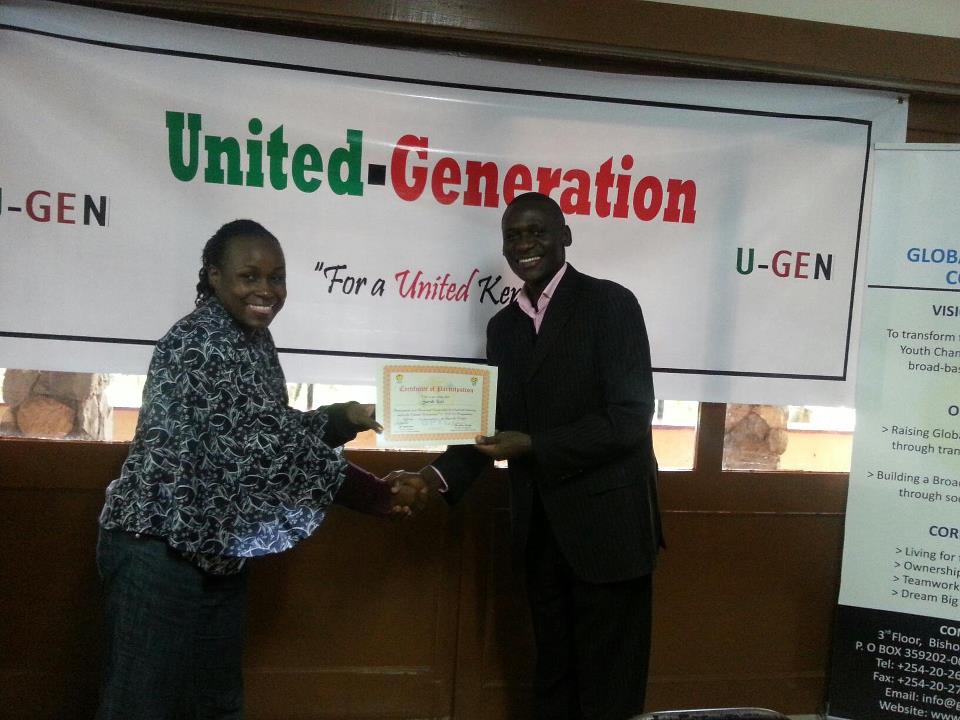 A man and woman shaking hands at the Global Peace Youth U-Generation event in Kenya.