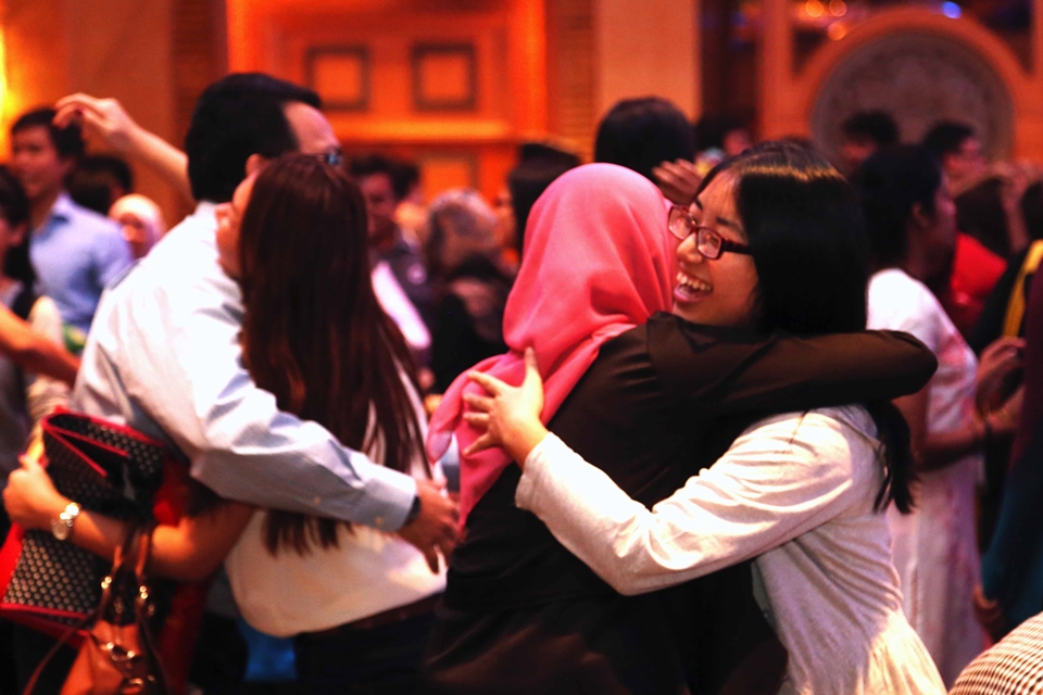 Young leaders, volunteers, and participants embrace each other at the conclusion of the Global Youth Fest.