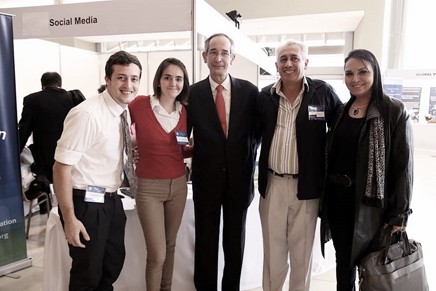 H.E. Colom and volunteers at Global Peace Convention 2014
