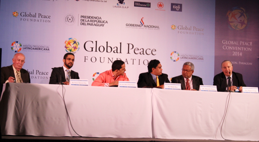 Panelists engaged in discussion at the Transforming Nations global peace foundation 2014 conference.