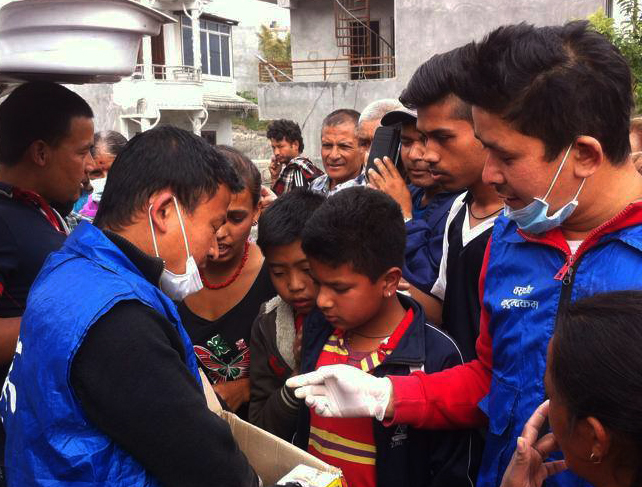 Nepali children waiting to receive food for their families