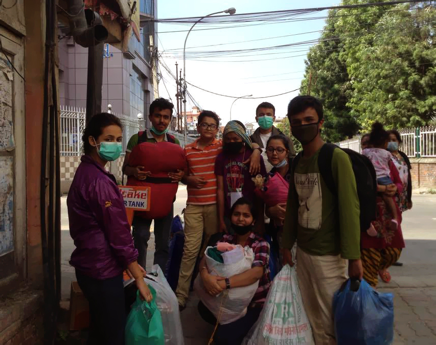 Rise Nepal volunteers distribute clothes in Tudikhel area.