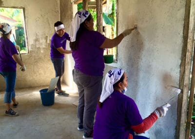 Global Peace Foundation Volunteers paint community center and school.