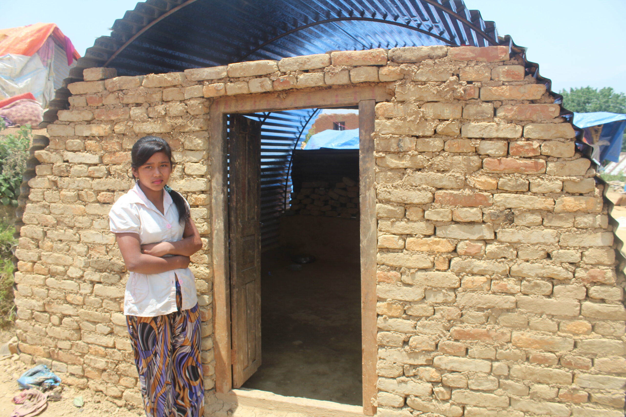 Global Peace Foundation volunteers build a transitional shelter for Nepal families.