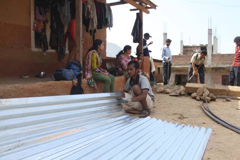 Volunteers assemble shelter pieces in Lamataar.