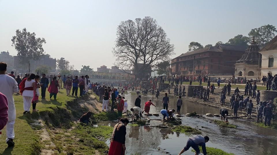 Nepalese volunteers clean the Guheshowari Area of Bagmati River Cleaning during 100th Week Celebration.