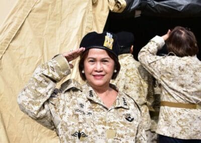 Attendee poses in Korean Fatigues