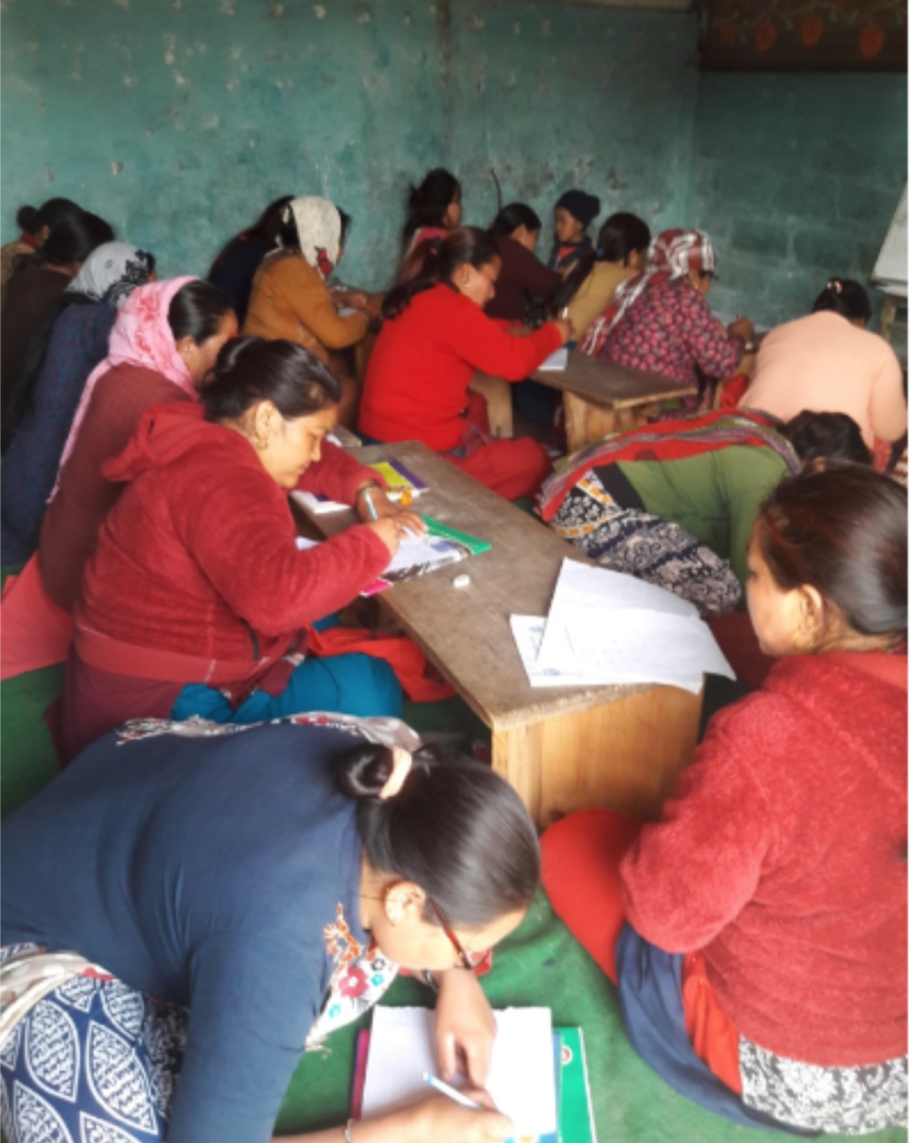 Women in a literacy class organized by Sapana