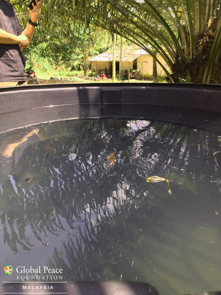 The tank slowly filling up with water from the well. The water is cloudy and has bits and pieces of debris but with the LifeStraw filters, this water will be safe to drink even without boiling.