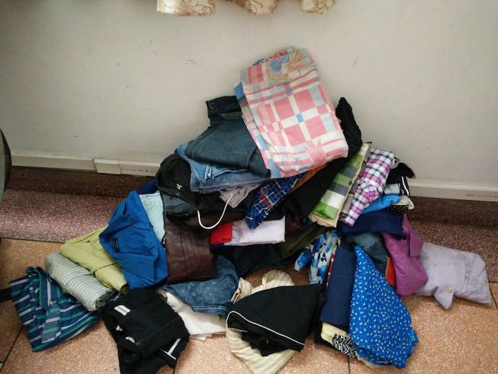 Clothes stacked from collection drive for Arya orphans