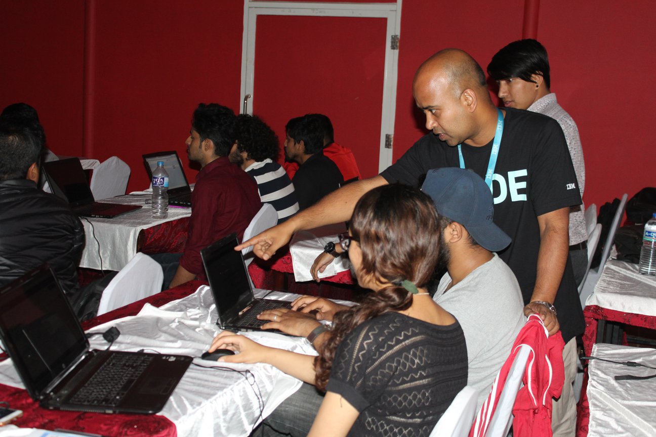 Participants work with IBM representatives and other experts in coding workshop