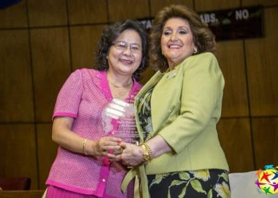 Mrs. Cristina Field, regional representative of Global Peace Women awarding María Dolores Galli de Florentín, President of the Santa Lucía Association