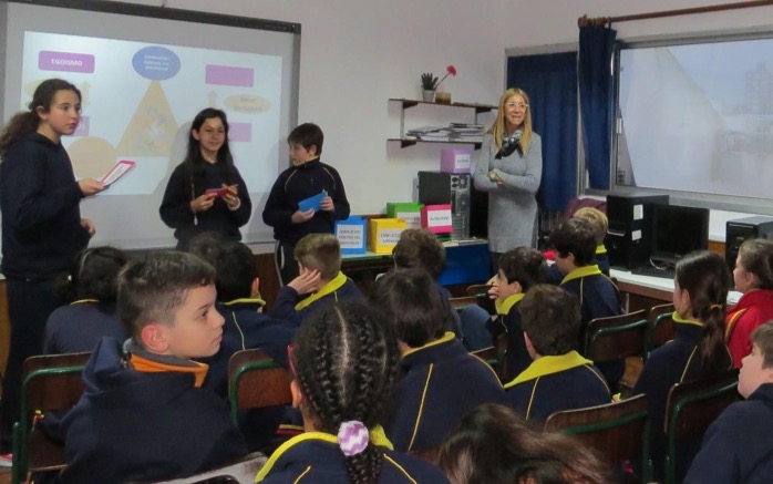 Young women present to elementary schools in Uruguay 