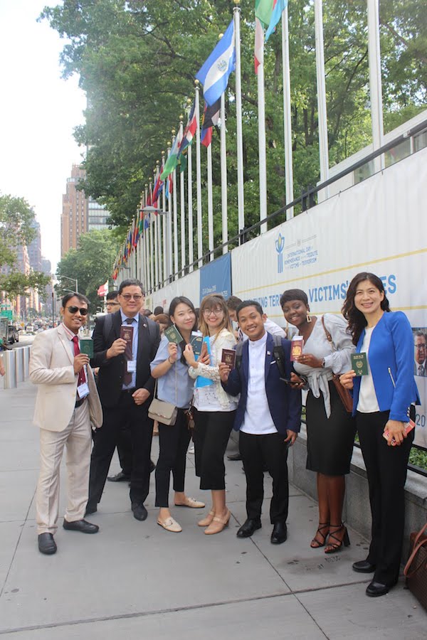 International delegates stand outside the United Nations awaiting the IYLA summit