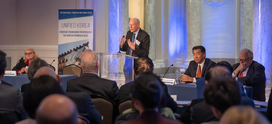 John Everard speaks alongside One Korea forum panel (from left: Alicia Campi, Dr. Hyun Jin P. Moon, and Dr. Edwin Feulner)