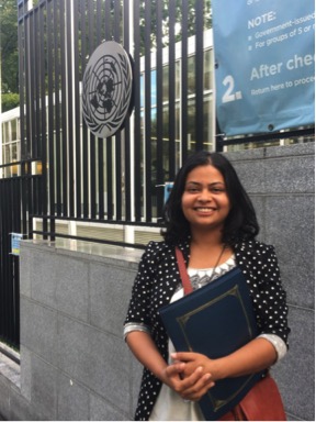 Kripa Sigdel stands in front of the United Nations during the IYLA Global Youth Summit in New York City