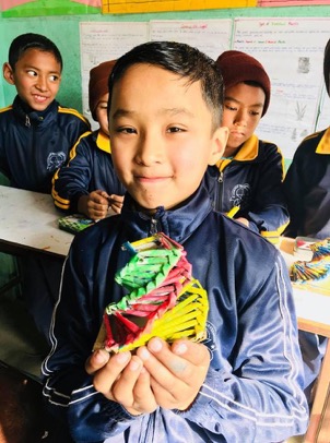 Children at Future Star English School create crafts out of recycled materials