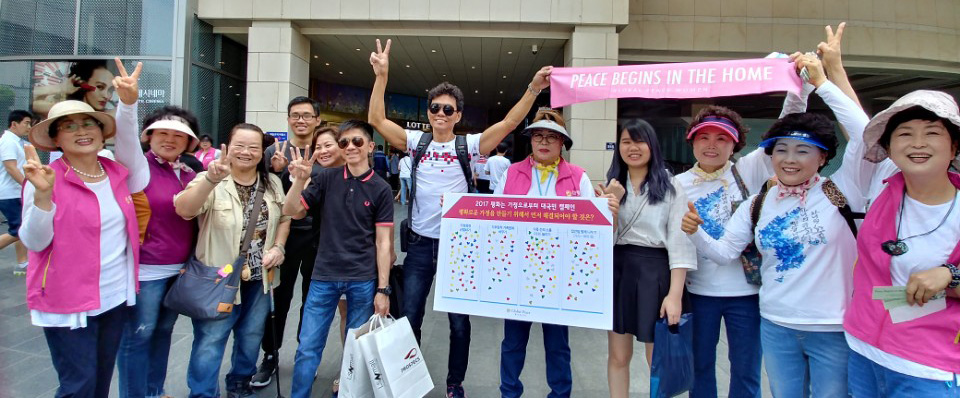 Tourists and Korean citizens alike show support for reunification and Peace Begins in the Home campaign