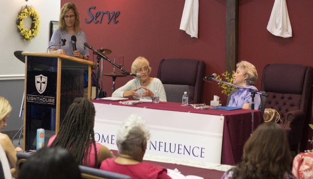 Rachel Murray, Lorraine Hiskey, and Trish Wynkoop address women leaders at the Women of Influence program