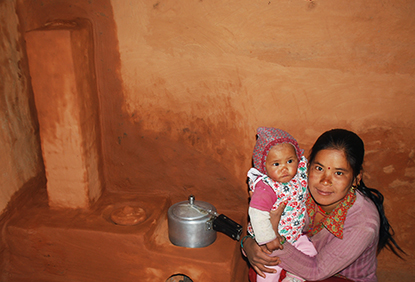 Woman with child cookstove