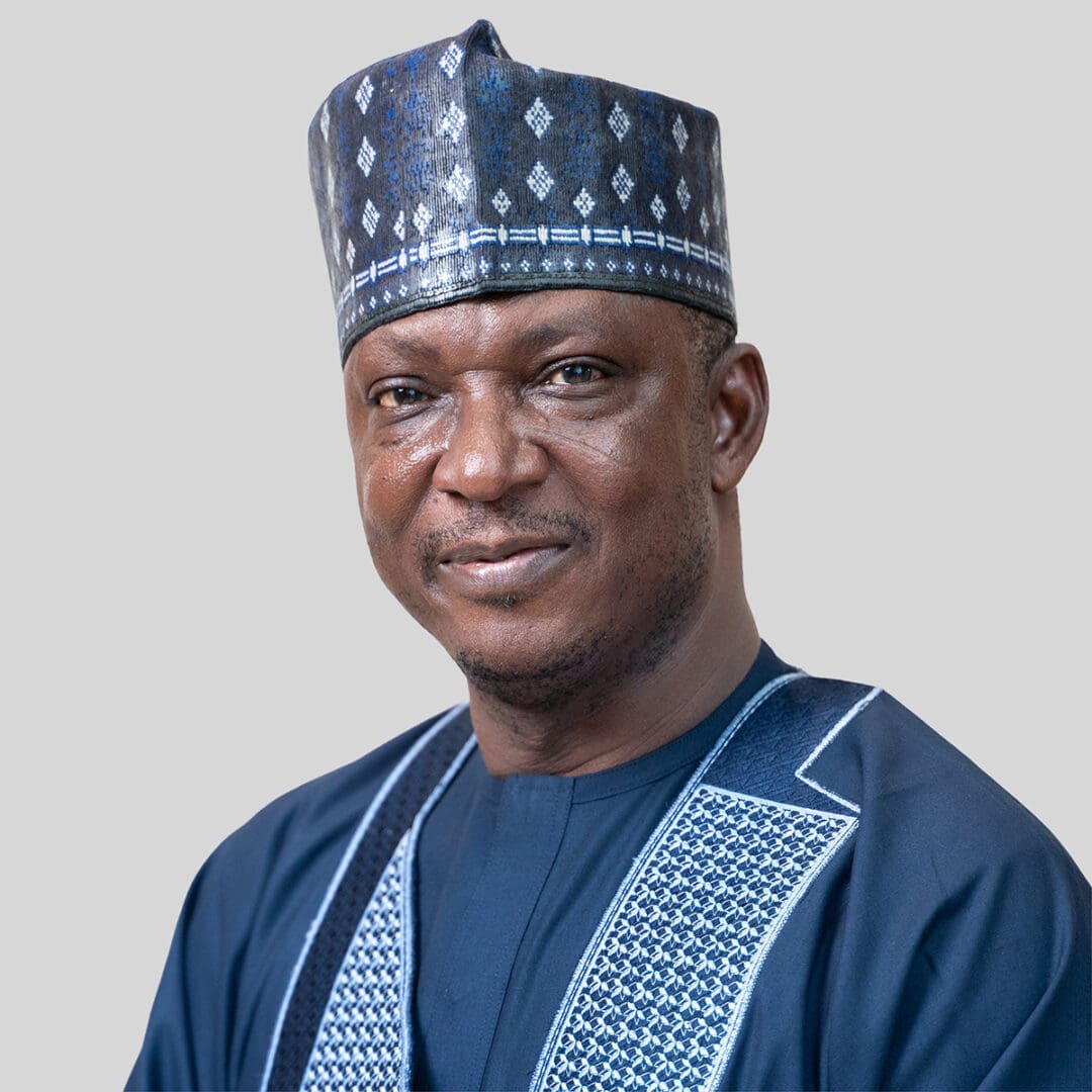 John Joseph Hayab Rev. John Joseph Hayab, wearing a traditional cap and embroidered attire, smiles against a neutral background.