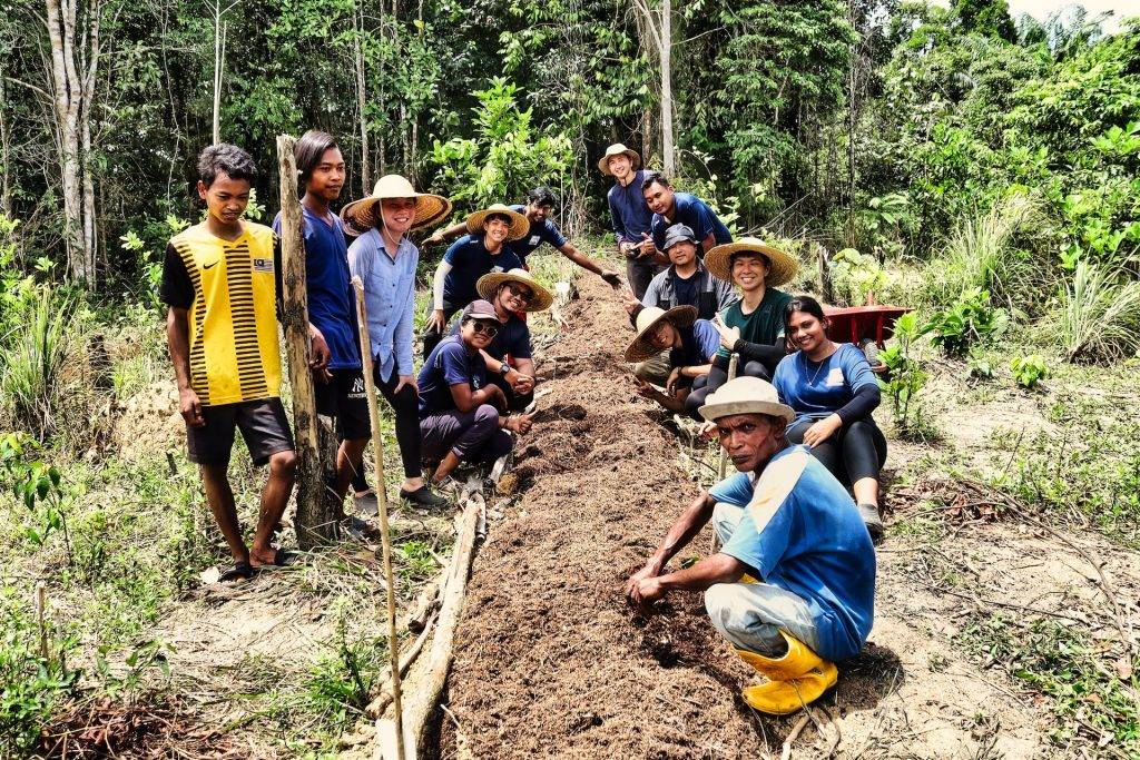 Group of volunteers working the soil