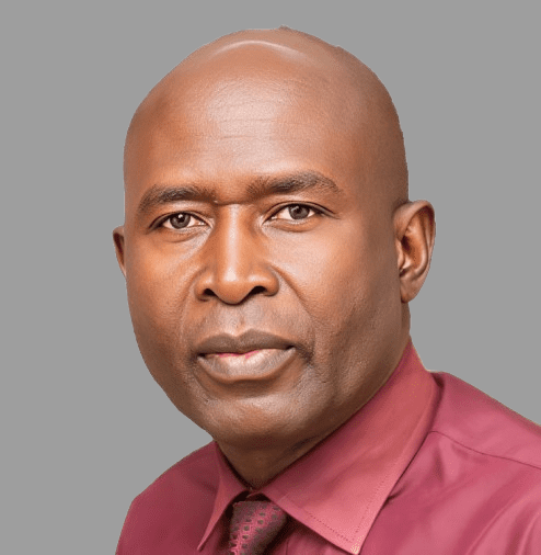 Daniel Juma Omondi A man with a bald head, wearing a maroon shirt and tie, faces forward against a plain grey background—Daniel Juma Omondi.