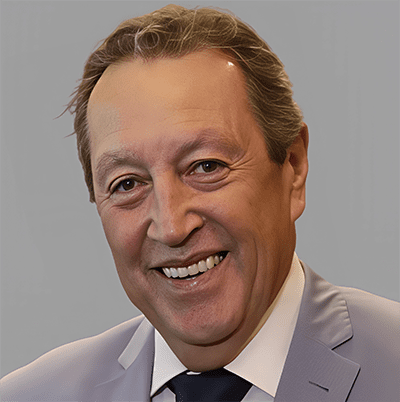 S2 Lessons Learned Latin America & Africa 2. H.E. Venicio Cerezo H.E. Marco Cerezo, a middle-aged man in a light gray suit and dark tie, smiles at the camera against a plain gray background.