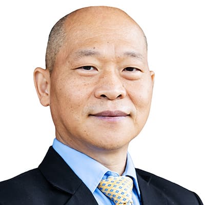 Yeqing Li Victor Li, wearing a black suit jacket, light blue shirt, and yellow patterned tie, poses for a headshot against a white background.