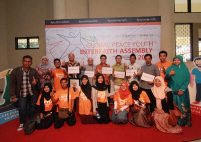 Participants gather to take a group photo with speakers, (third from left and on) James Poon, Romo Carolus, Agus Imam Sonhaji,