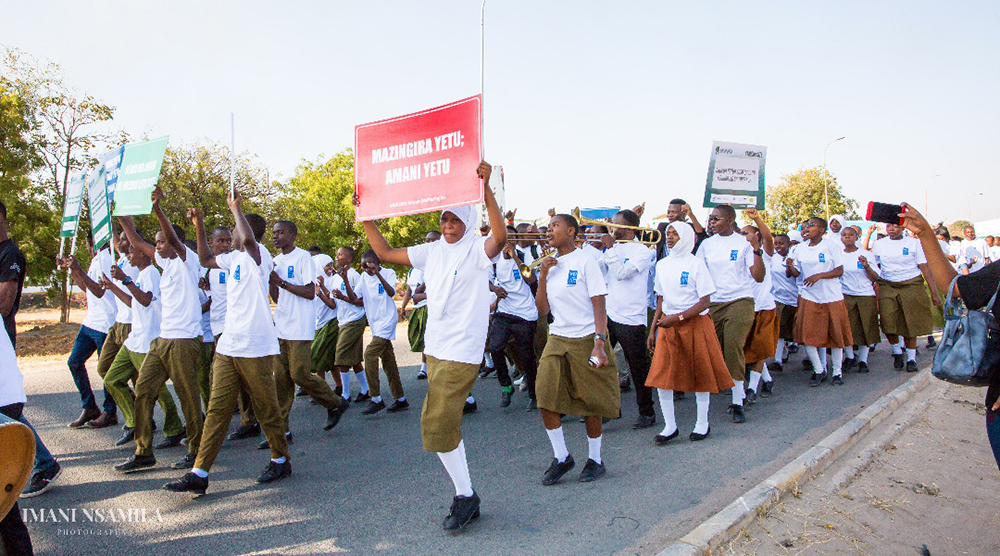 A peaceful match of youths and students, carrying various peace messages as a symbol of celebrating International Peace Day.