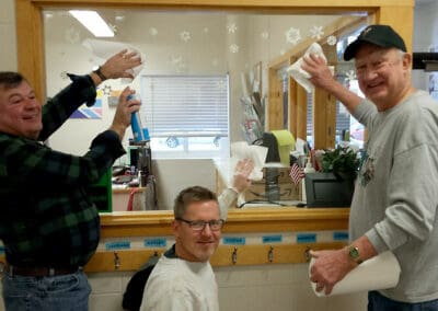 Pastor Gil, Pastor Matt, and Dean clean the Friendship House