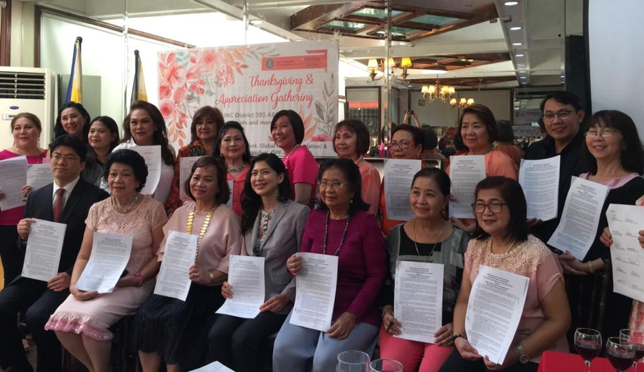 A group of women posing for a photo with their certificates.