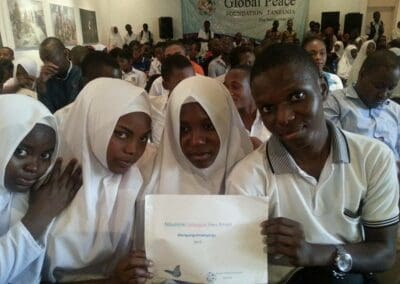 Tanzanian Youth Pose with #PeaceDay Sign at Celebration