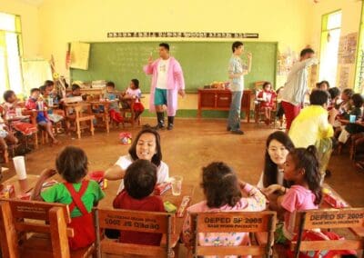 International volunteers teach an oral hygiene class.