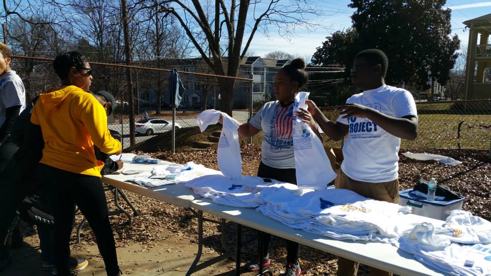 Handing out MLK Day volunteer tshirts.