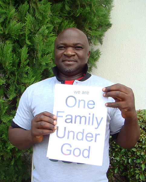 A Participant Shows Support for "One Family under God"