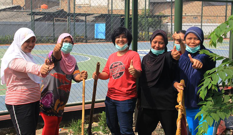 Enthusiastic volunteers clean their community.