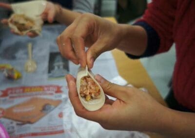 A close up of the process of making dumplings