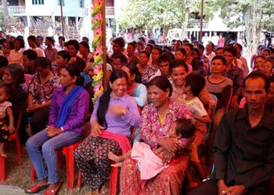 Villagers anticipate the distribution of solar lamps in Cambodia.