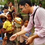Global Peace Youth Cambodia member plays an ice-breaker with village children.