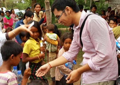 Global Peace Youth Cambodia member plays an ice-breaker with village children.