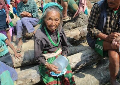 Global Peace Foundation distributes solar lamp to Nepal earthquake victims.