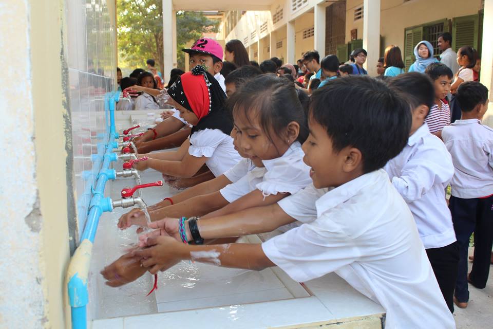 School children wash hands at newly built washing area