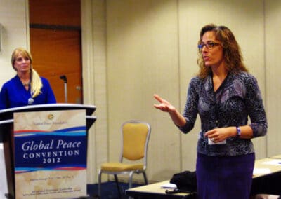 Mrs. Rachel Murray, Director of the Music Lighthouse Christian Fellowship addresses the audience at the Global Peace Women networking luncheon in Atlanta for the 2012 GPC.