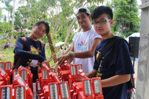 Global Peace Foundation young leaders pack LED solar lanterns.