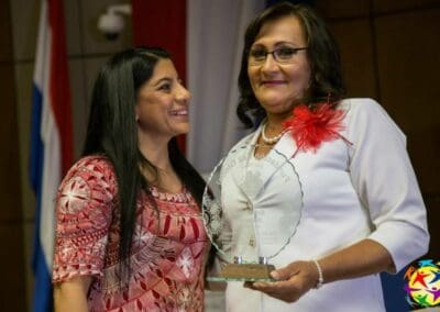 Marlene Ocampos, governor of the Department of Alto Parguay present Mirna Orrego the Living for the Sake of Others Award, Global Peace Foundation, Paraguay