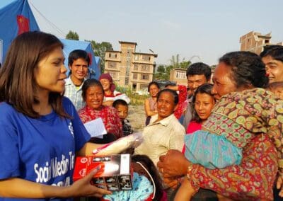Global Peace Foundation give solar lamps to women and children in Nepal.